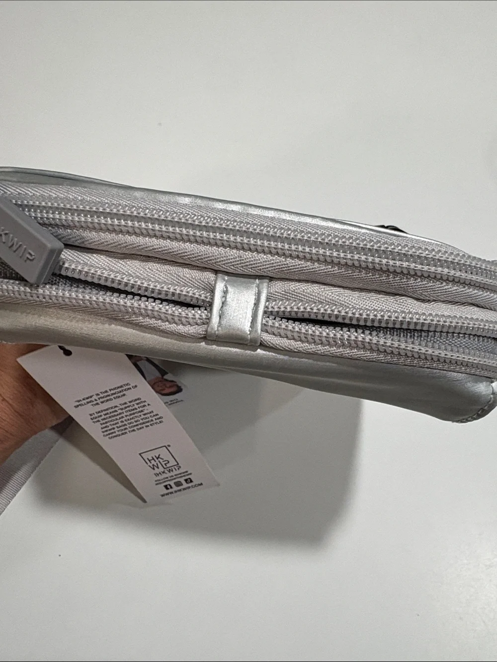Ikwhip Metallic Matte Silver Everyday Crossbody Bag. Lots of pockets! Web strap